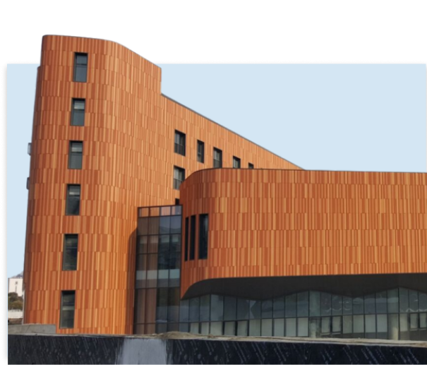 Building with Clayton terracotta facade and orange cladding.