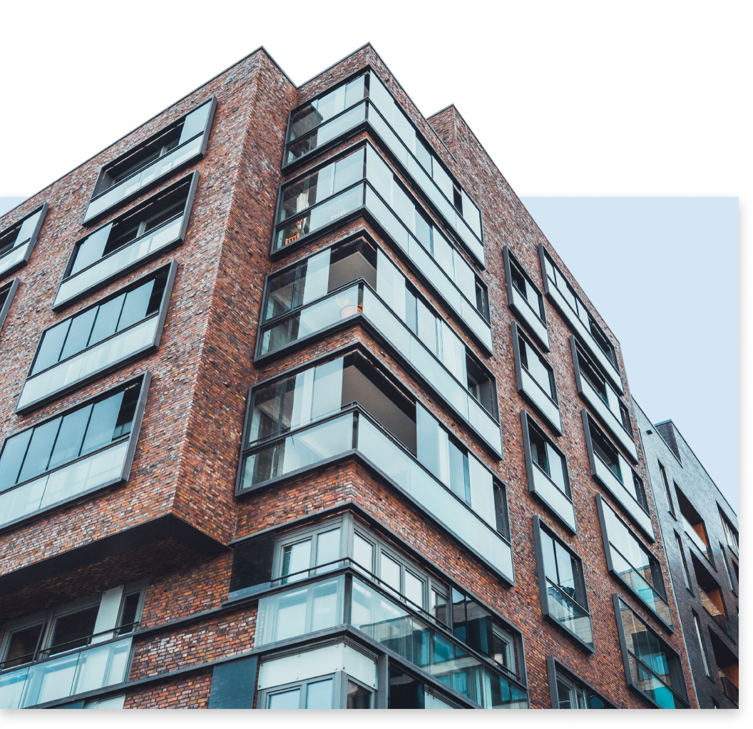 Building exterior with Smartbric brick slip cladding and large windows.